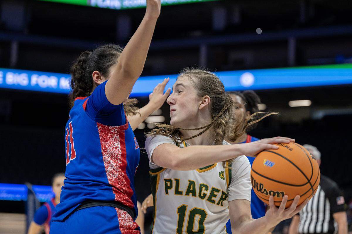 The East Union Lancers' Shebra Rezaye defends the Placer Hillgals' Alex Hall in the first half of the Sac-Joaquin Section Division III championship on Saturday at Golden 1 Center.