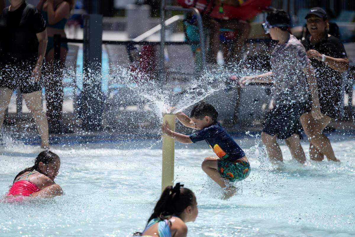 Children play in the pool at the North Natomas Aquatic Complex as temperatures reach 103 on Monday, July 1, 2024 in Sacramento. 