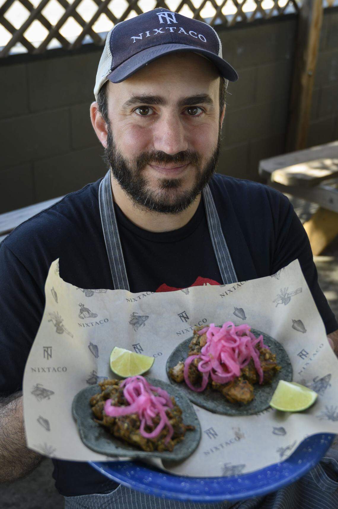 Patricio Wise, chef and proprietor at Nixtaco in Roseville, holds a plate of chicharron tacos in 2019. The chicken and crab clay pot at Yue Huang in 2017. The restaurant was announced as a 2021 Sacramento-area Bib Gourmand winner Wednesday.