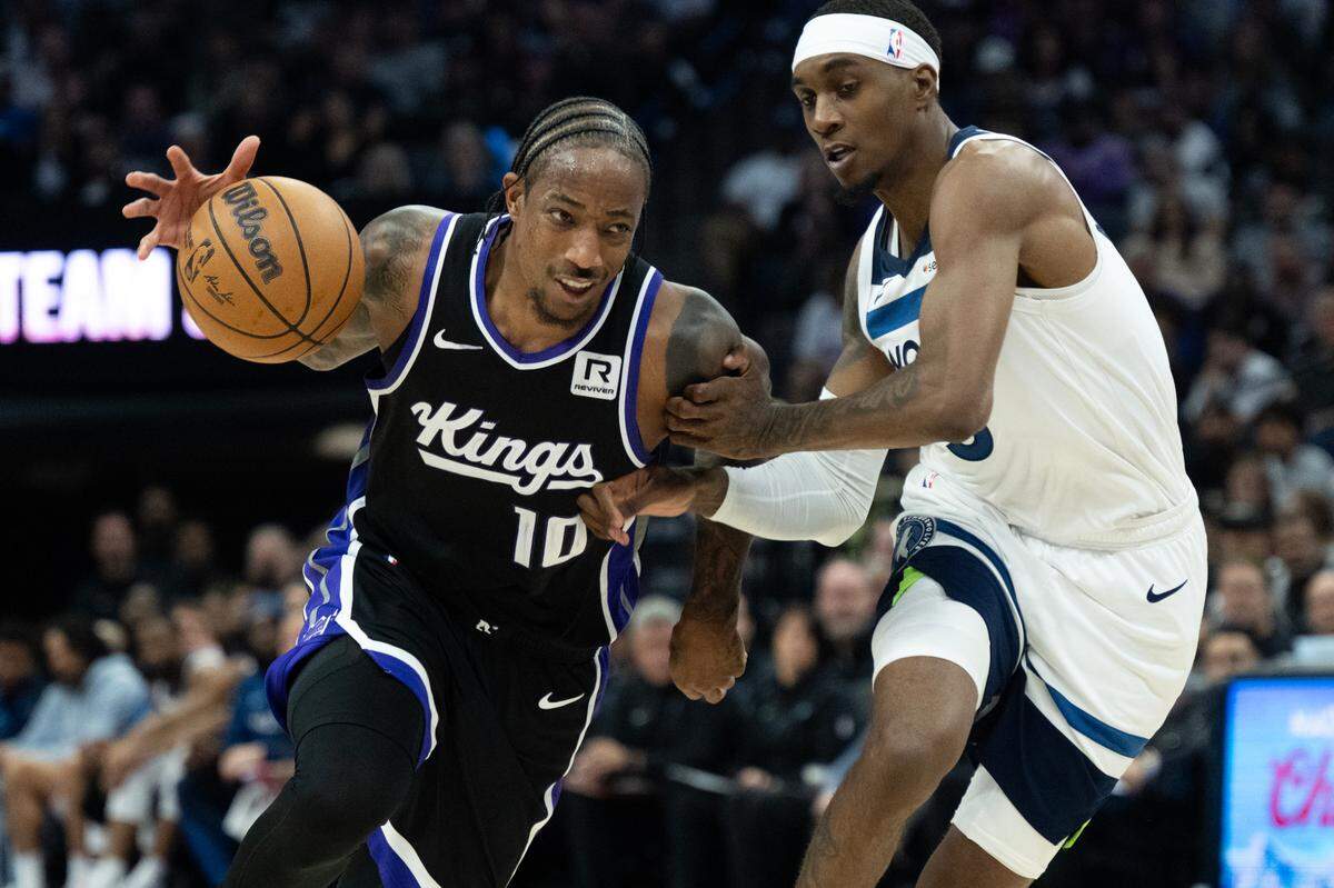 Sacramento Kings forward DeMar DeRozan (10) drives against Minnesota Timberwolves forward Jaden McDaniels (3) during the season opener at Golden 1 Center on Thursday, Oct. 24, 2024 in Sacramento.