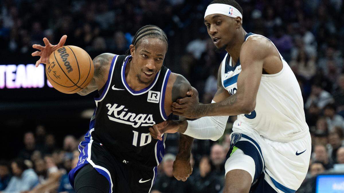 Sacramento Kings forward DeMar DeRozan (10) drives against Minnesota Timberwolves forward Jaden McDaniels (3) during the season opener at Golden 1 Center on Thursday.