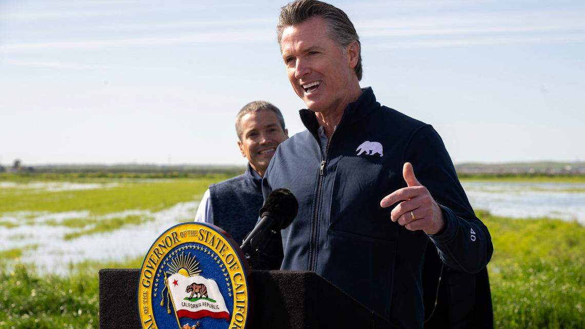 Gov. Gavin Newsom speaks during a press conference Friday, March 24, 2023, at a farm in Dunnigan where fields are being flooded to recharge the groundwater basin. Newsom ended some of California’s water restrictions because state reservoirs have been replenished by a series of atmospheric river storms after three years of drought.