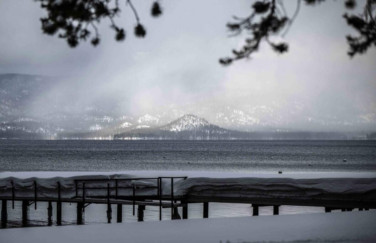 Snow begins to fall on Lake Tahoe on Monday, March 6, 2023.