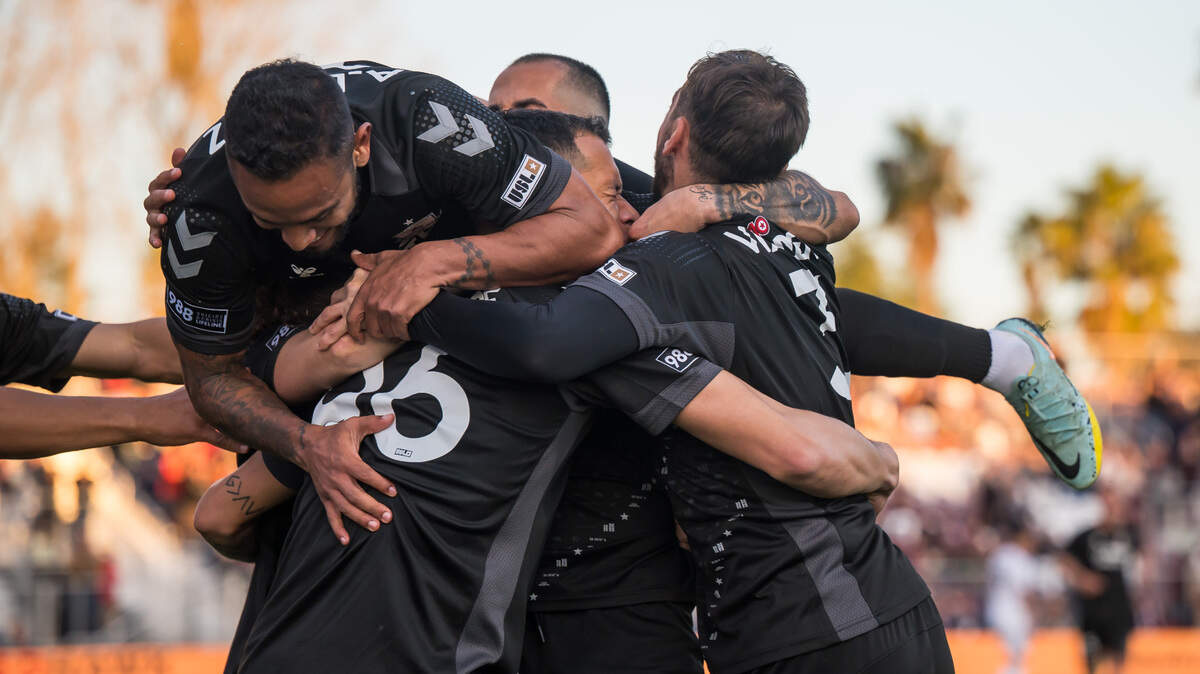 Sacramento Republic FC midfielder Arnold Lopez (29) dives on top of teammates celebrating a goal by midfielder Luis Felipe (96), center, against Louisville City FC during the first half of the USL soccer game Saturday, April 1, 2023, at Heart Health Park. Sac Republic shut out Louisville 5-0.