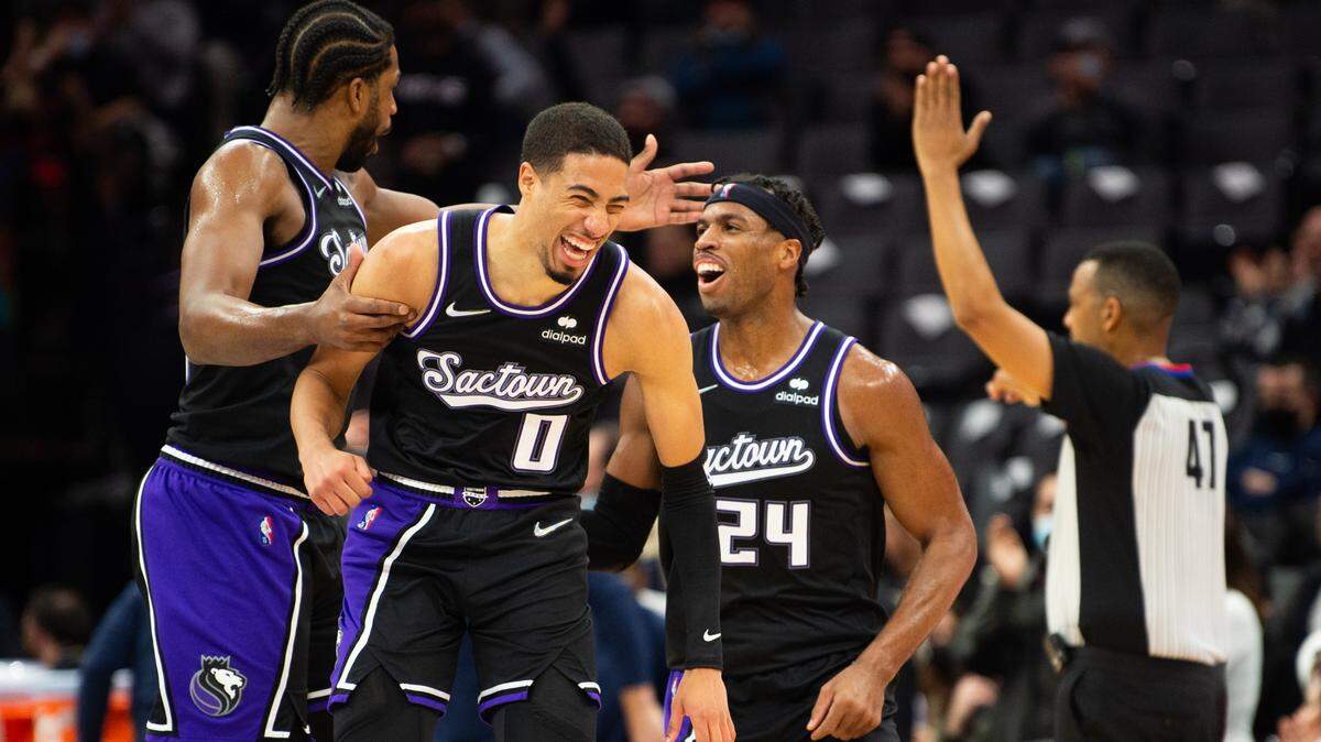 Sacramento Kings center Tristan Thompson (13) and Sacramento Kings guard Tyrese Haliburton (0) celebrate after Sacramento Kings guard Buddy Hield (24) three-point basket in the first half during a game at the Golden 1 Center on Friday, Dec 17, 2021, in Sacramento.