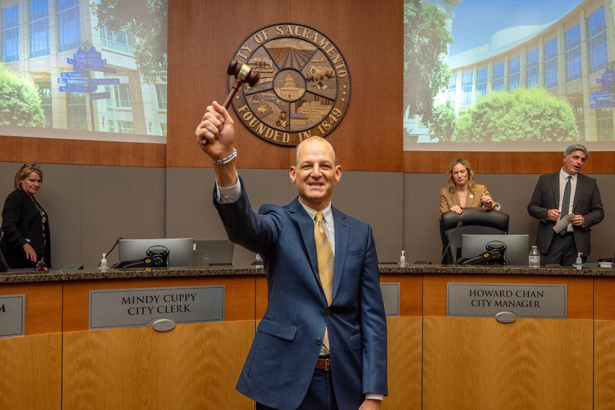 Sacramento mayor Kevin McCarty lifts the gavel to the crowd after the new Sacramento City Council was sworn in on Tuesday night.