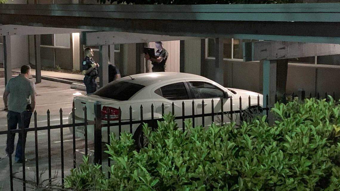 Police investigate a vehicle believed to be used by a suspect in the fatal shooting of a man in East Sacramento on Thursday, Oct. 20, 2022. The suspect, DeSean Leon Brasser, was arrested by SWAT officers at an apartment in the Pocket section of Sacramento that night.