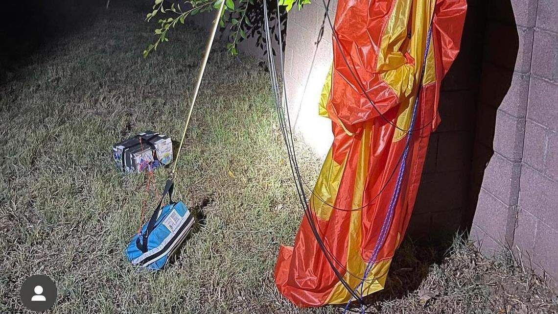 Authorities evacuated a California neighborhood after a parachute with suspicious packages attached was spotted.