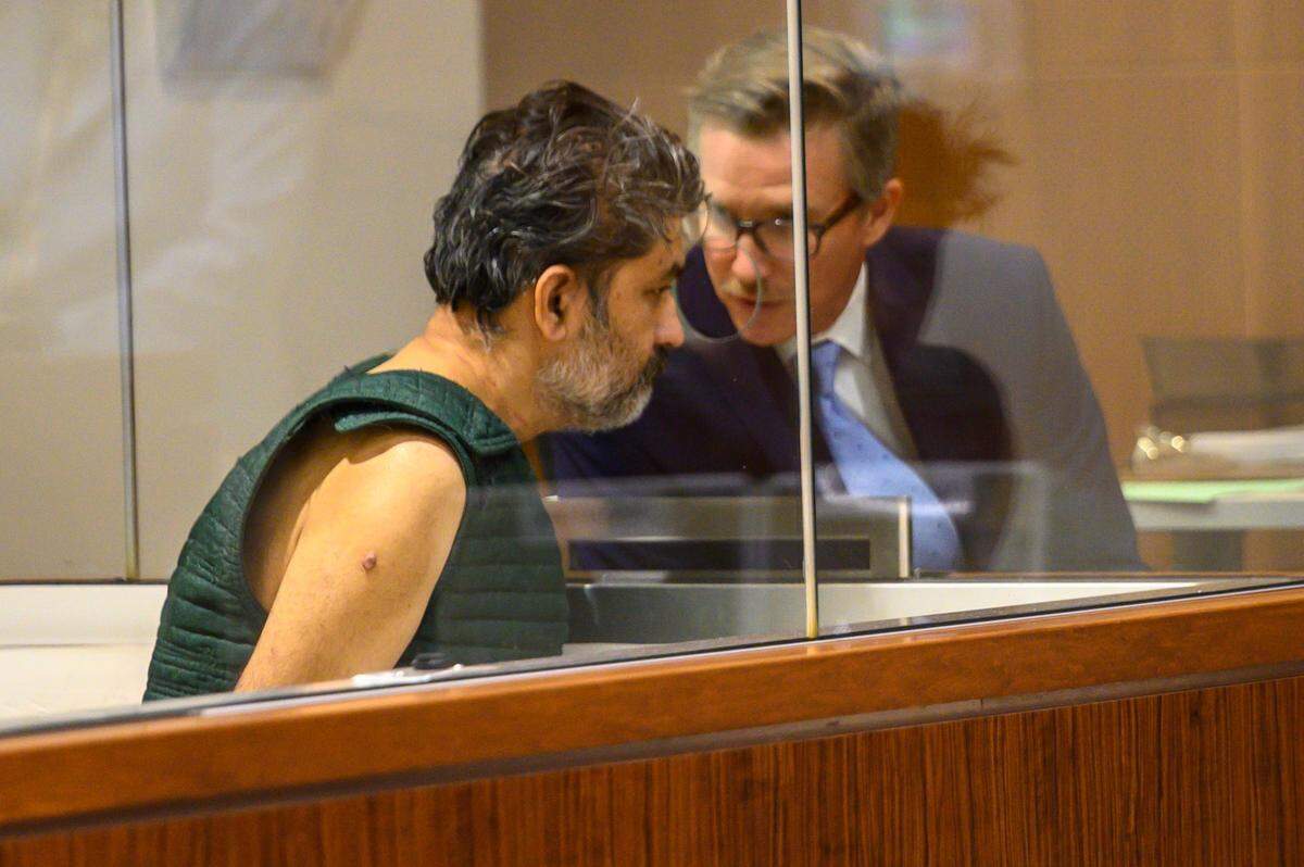 Shankar Hangud chats with public defender Martin Jones through a plexiglass arraignment cell in Placer Superior Court in 2019 after being arrested on suspicion of slaying four family members. Sacramento County’s new courthouse, under construction now, will feature a similar design that replaces the bars with plexiglass.