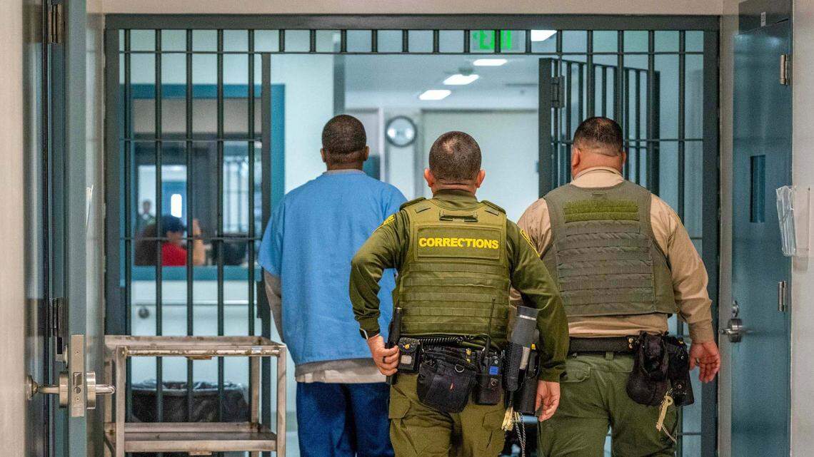 Correctional officers escort an inmate housed in Salinas Valley State Prison’s Psychiatric Inpatient Program to his cell on March 6, 2025. A contract between a nonprofit and the prison health care agency to provide sanitary services to a similar unit in Vacaville is set to expire June 30, putting 58 jobs in question.