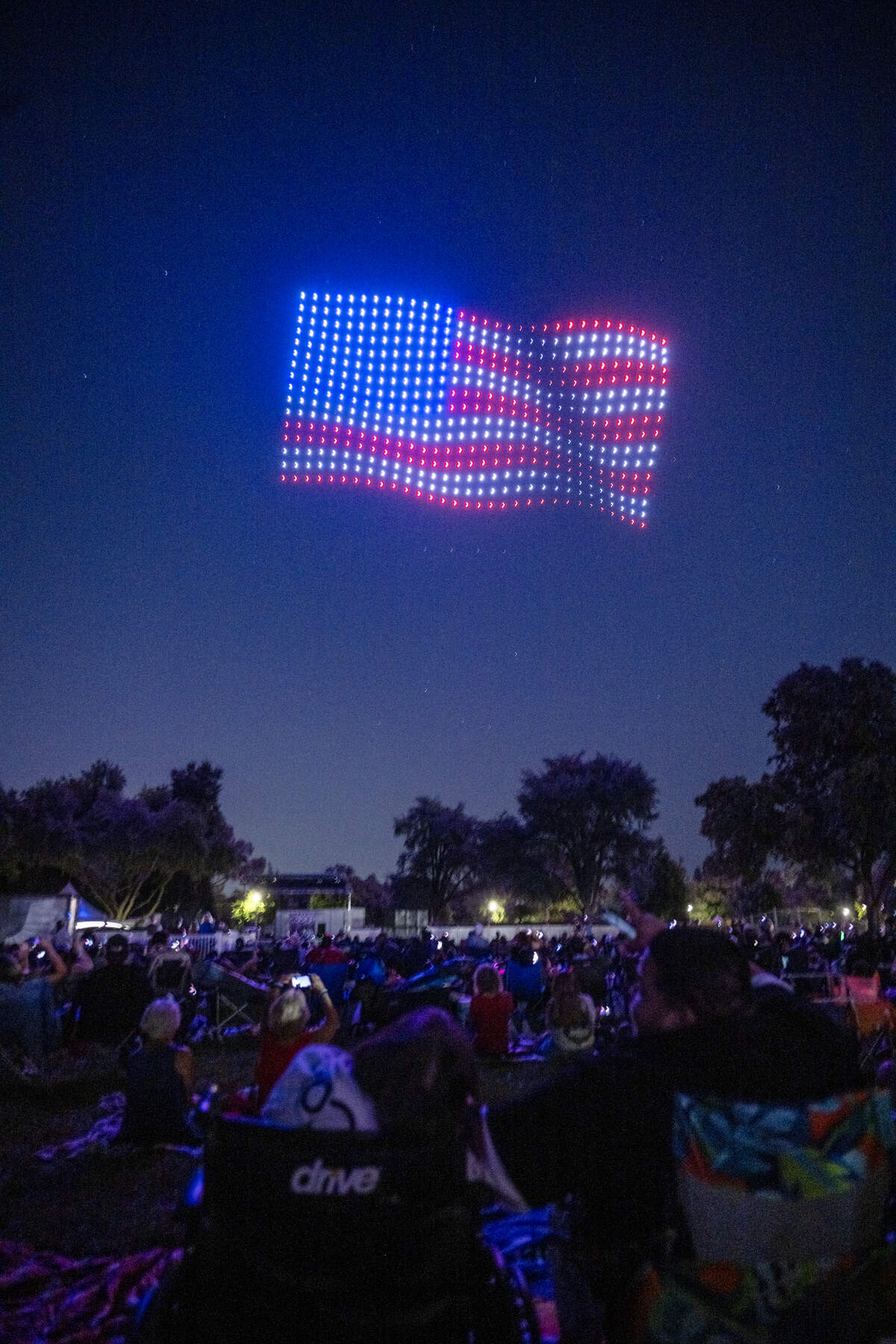 An American flag is projected into the night sky during a drone show at the Fourth of July celebration at Hagan Community Park in Rancho Cordova on Friday, July 3, 2026.