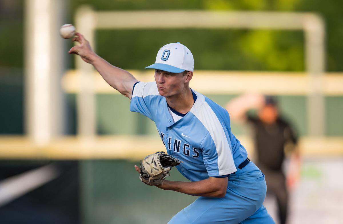 Oakmont Vikings pitcher Kurt Marton (2) throws against Woodland Wolves batter Aidan Olsen (21) during the bottom of the fifth inning of the CIF Sac-Joaquin Section Division IV high school baseball championship game Wednesday, May 24, 2023, at Sacramento City College. Oakmont beat Woodland, 10-0, for the section title.