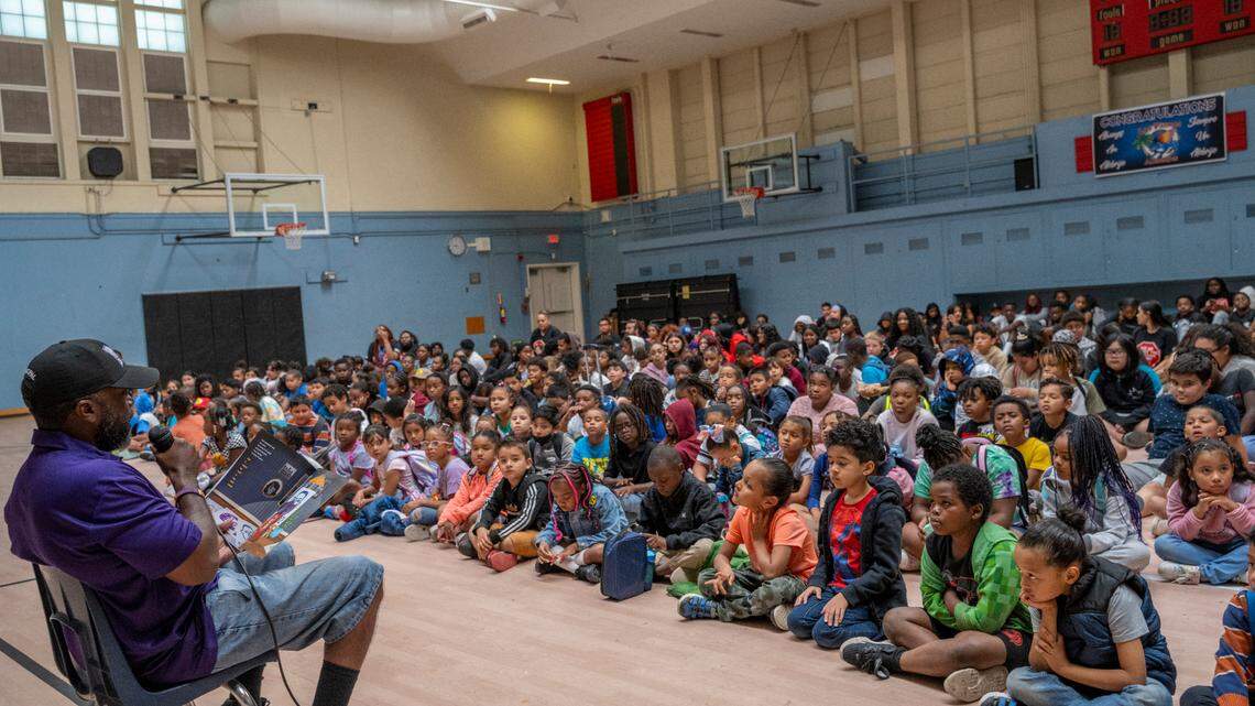 Wesley Marshall, the former principal at Martin Luther King Jr. Technology Academy, reads aloud to students last summer at Las Palmas Elementary School in Sacramento. The students were participating in the Freedom School summer program run by Roberts Family Development Center.