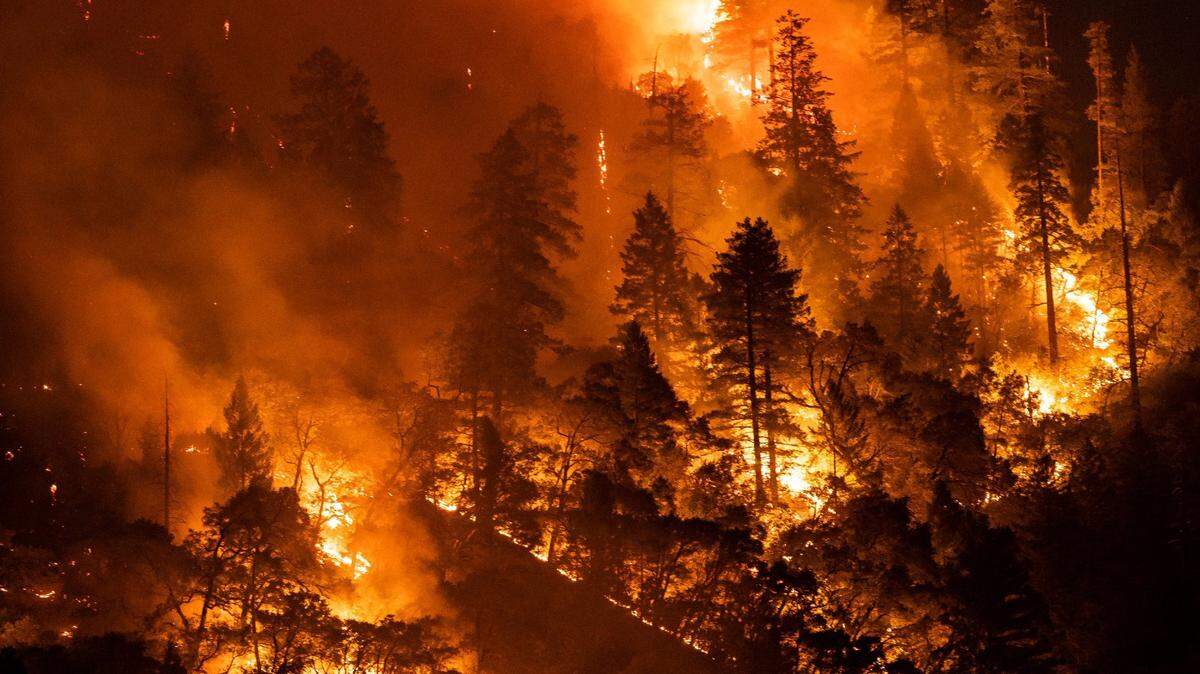 The Dixie Fire burns near Highway 70 on July 21, 2021, in the Feather River canyon in Plumas County. The blaze is the largest-single source wildfire in California history.