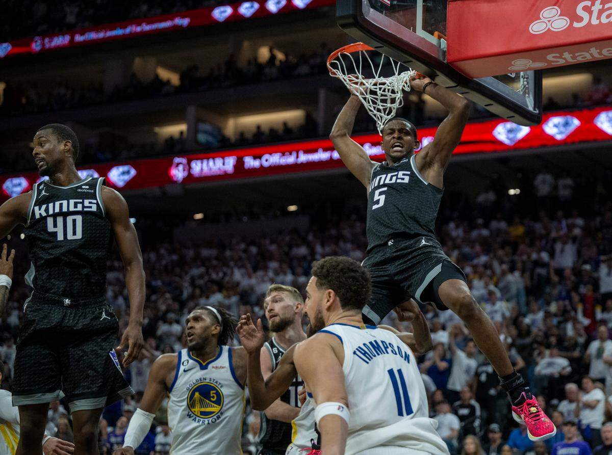 Sacramento Kings guard De’Aaron Fox (5) reacts after a basket during Game 1 of the first-round NBA playoff series at Golden 1 Center on Saturday, April 15, 2023.