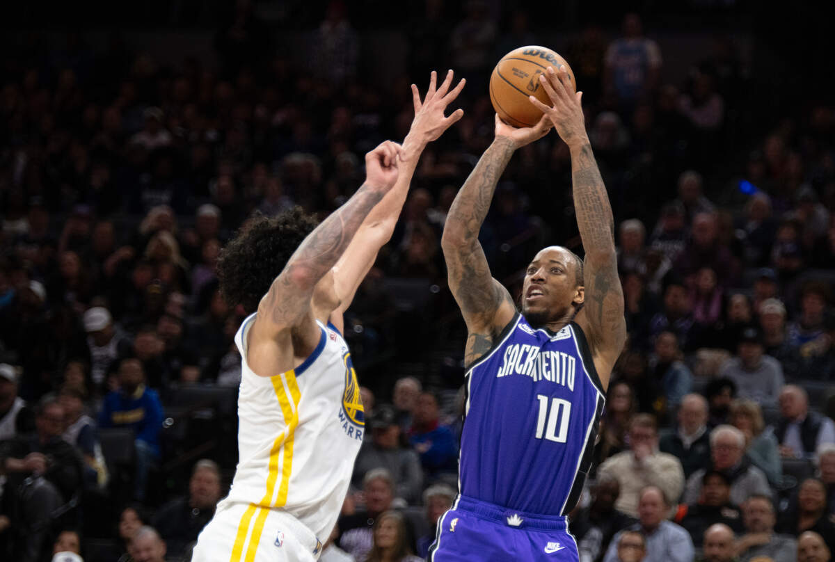 Sacramento Kings forward DeMar DeRozan (10) shoots and scores over Golden State Warriors forward Gui Santos (15) in the second half on Wednesday, Jan. 22, 2025 at the Golden 1 Center.