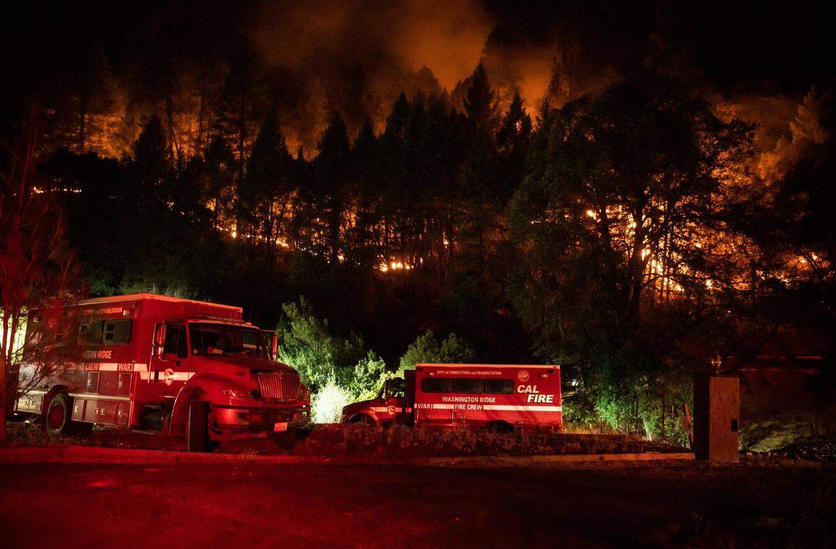 Cal Fire personnel try to contain the River Fire as it burns off Tokayana Way east of Bear River Park and campground near Colfax in August.