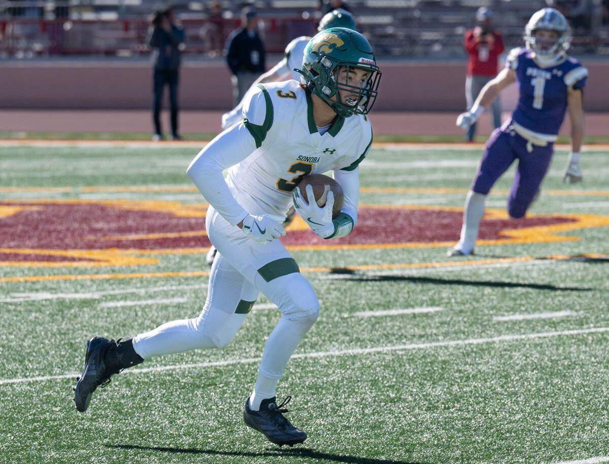 The Sonora Wildcats’ Tanner Navarro (3) returns an interception against Bradshaw Christian in the second half of the Sac-Joaquin Section Division VI championship game at Hughes Stadium in Sacramento on Friday, Nov. 29, 2024.