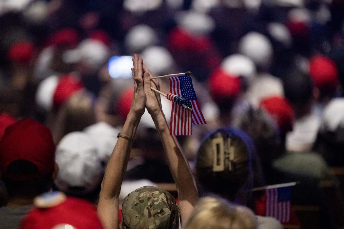 Attendees cheer for comedian-actor Rob Schneider and Christian author Frank Turek as they speak during the Turning Point USA tour event at UC Berkeley on Monday, Nov. 10, 2025. The two men were filling in for the organization's founder, conservative activist Charlie Kirk, who was fatally  shot two months ago. 