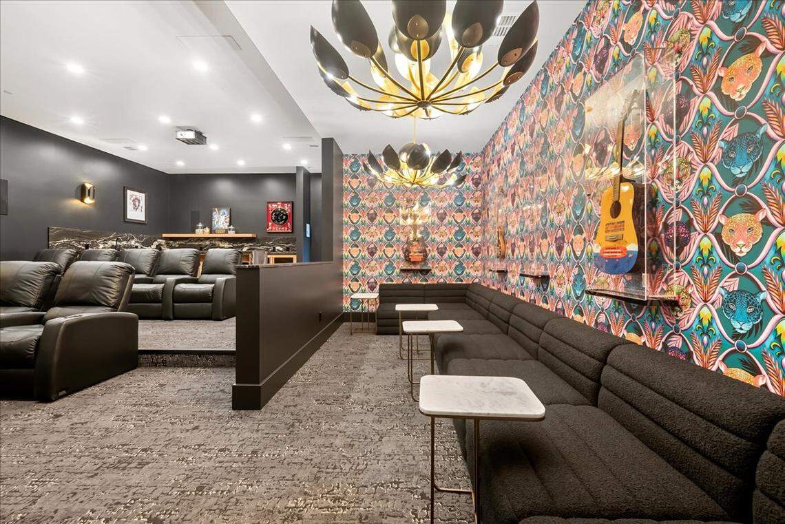 Custom concessions bar and roomy lounge create a real cinema experience inside the spacious, private theater.