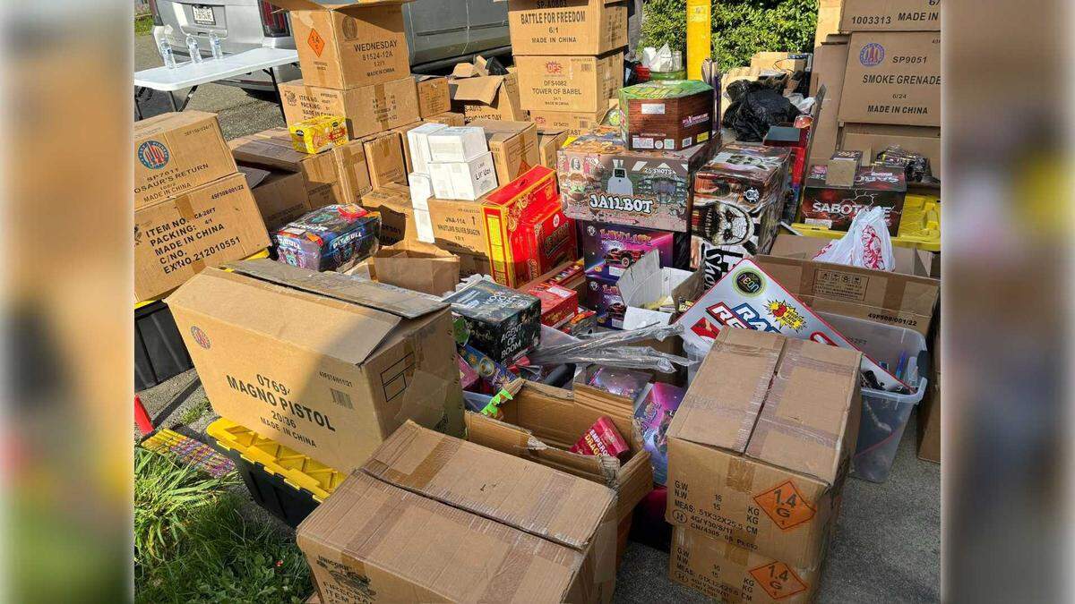 Boxes of illegal fireworks are stacked outside a Crescent City home sit following a warrant search on Friday in the Del Norte County town. Authorities say the fireworks were uncovered as part of the investigation into the deadly fireworks explosion July 1 in Esparto that killed seven workers.