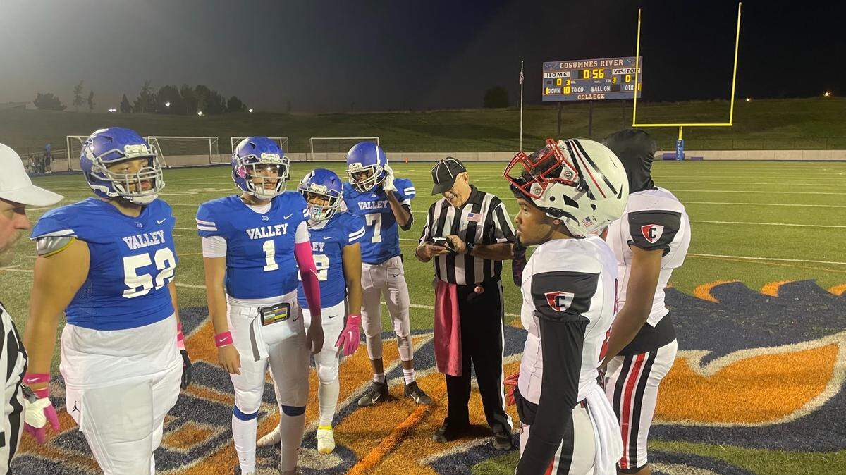 Valley Vikings and Cordova Lancers lineup for the pregame coin toss on Oct. 6.