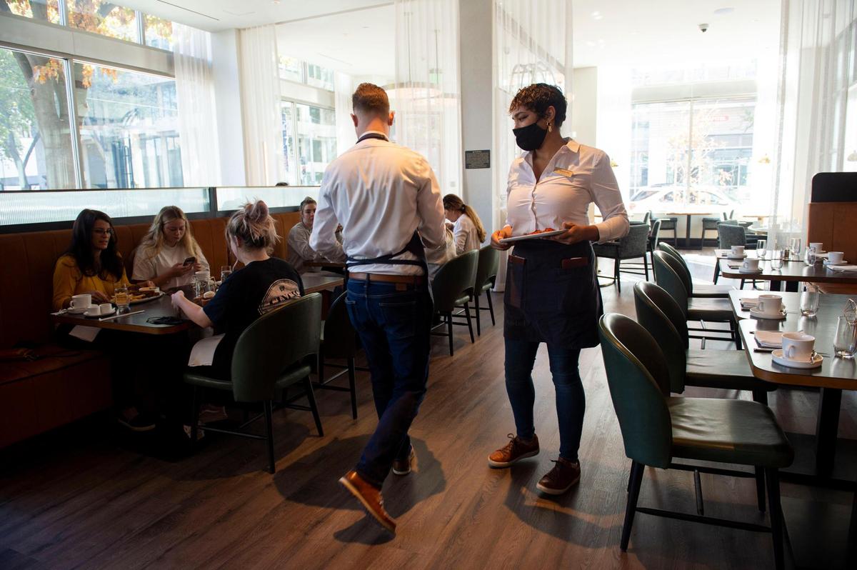 Waiters serve food at the new Hyatt Centric’s 7th Street Standard restaurant in November.
