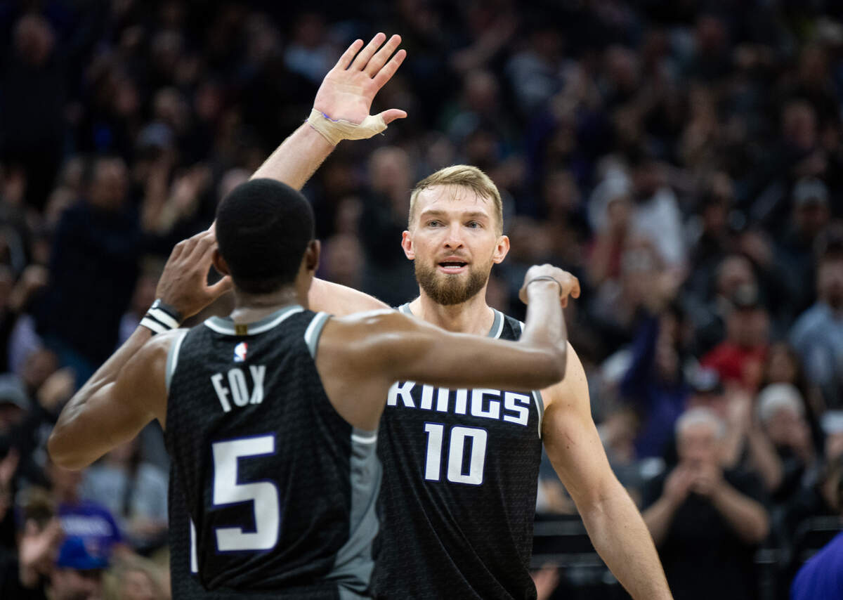 Sacramento Kings forward Domantas Sabonis (10) congratulates Sacramento Kings guard De’Aaron Fox (5) after a basket at Golden 1 Center in March.