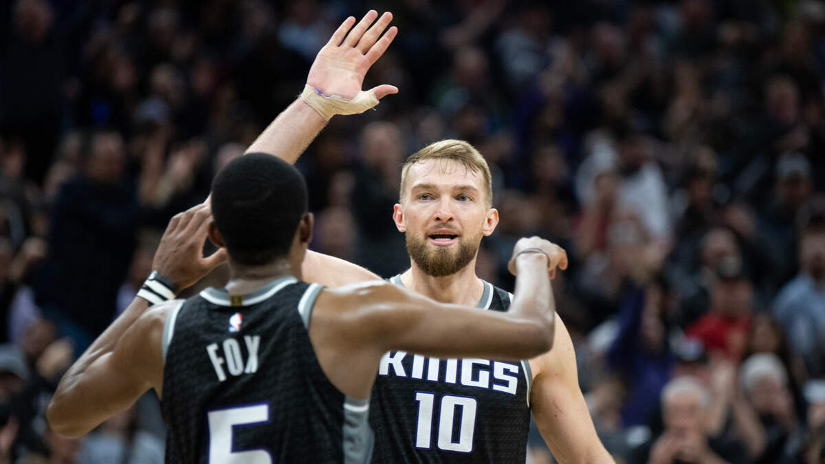 Sacramento Kings forward Domantas Sabonis (10) congratulates Sacramento Kings guard De’Aaron Fox (5) after basket in the fourth quarter during a game at the Golden 1 Center in Sacramento, Monday, March 13, 2023.