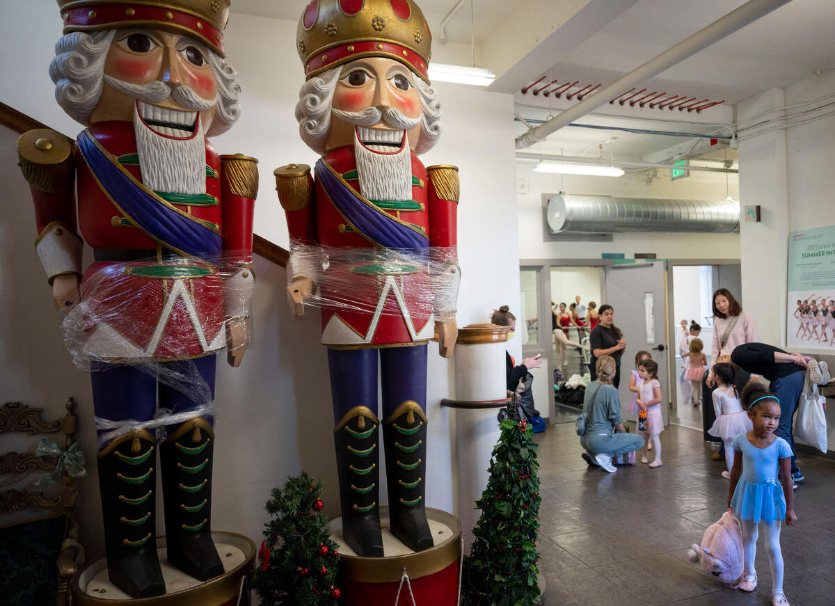 Two 12-foot tall nutcrackers stand in the hallway as young performers get ready for photo sessions at the Sacramento Ballet studios in midtown Nov. 4.