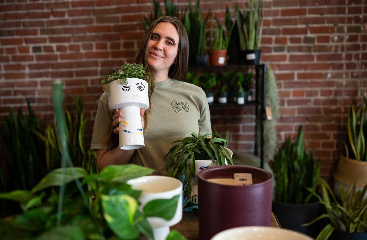 Owner Alli Okumura holds one of the “sassy pots” that she’s featuring ahead of Mother’s Day at Propagate Plants & Gatherings on Wednesday.