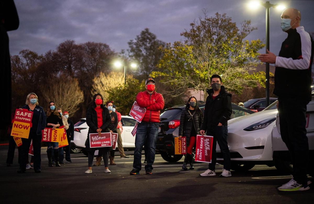 Nurses and their union representatives talk at a car rally at Sutter Roseville Medical Center on Dec. 15, 2020.