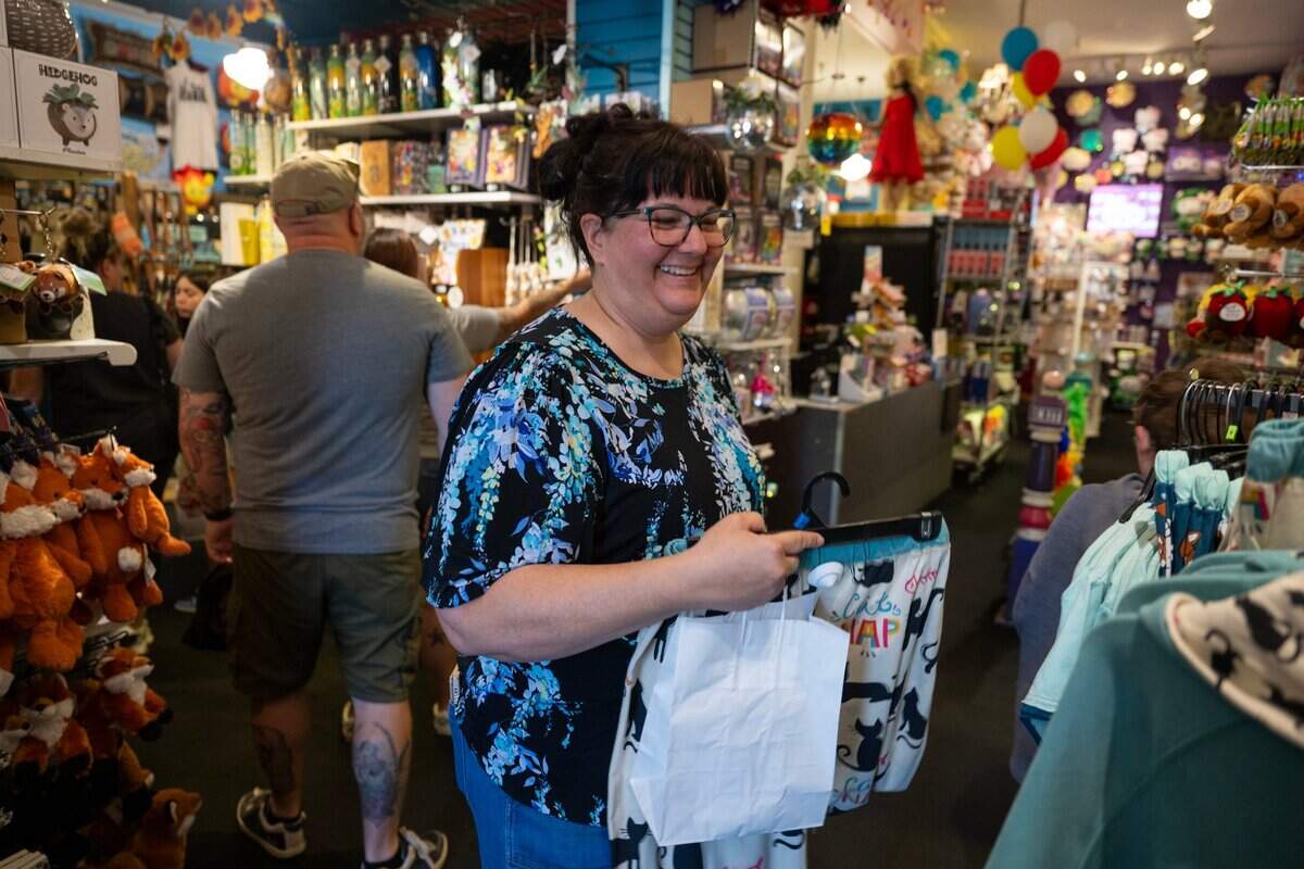 Debra Witthar, who said she has been shopping at Evangeline’s since she was a teenager, picks out items at the Old Sacramento store on Wednesday, July 10, 2024. Evangeline’s is celebrating their 50th anniversary in business.