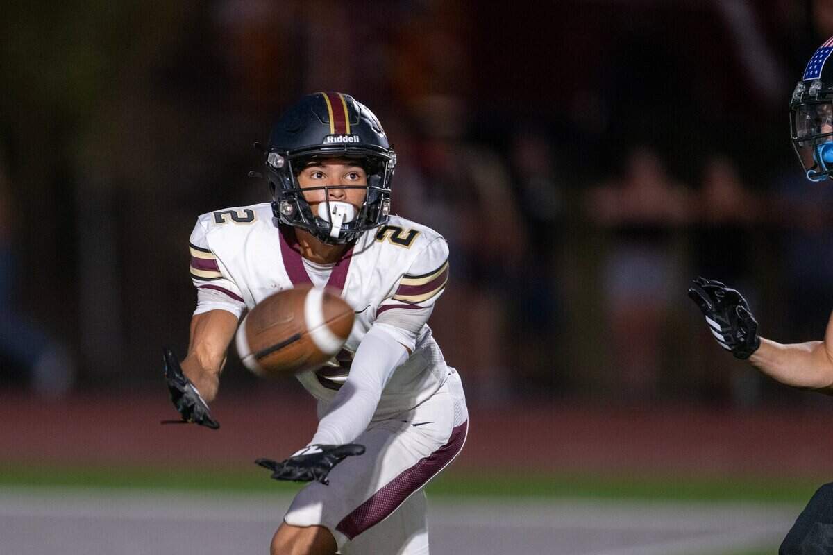 Whitney Wildcats’ wide receiver Gettis Rose (2) catches a touchdown pass in the first quarter against the Twelve Bridges Raging Rhinos on Friday.
