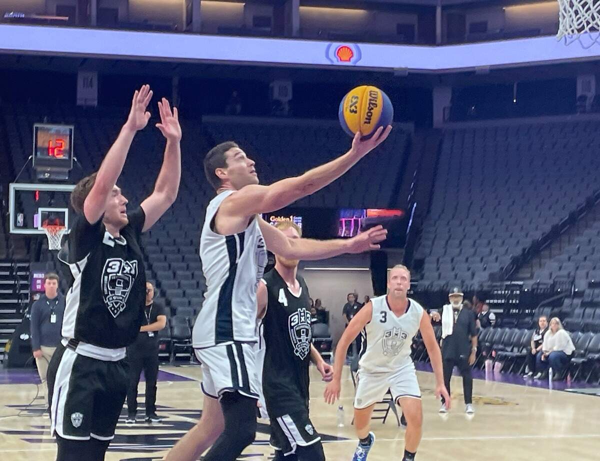 Jimmer Fredette of Team Miami, in the championship game, drives past Trey Bardsley of Team Omaha for the layup on Sunday, Oct. 1, 2023.