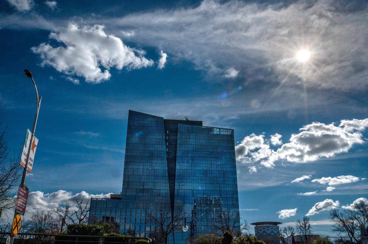 The sun peeks through the clouds on Thursday above the new state Natural Resources headquarters building that is planned to open this summer in downtown Sacramento.