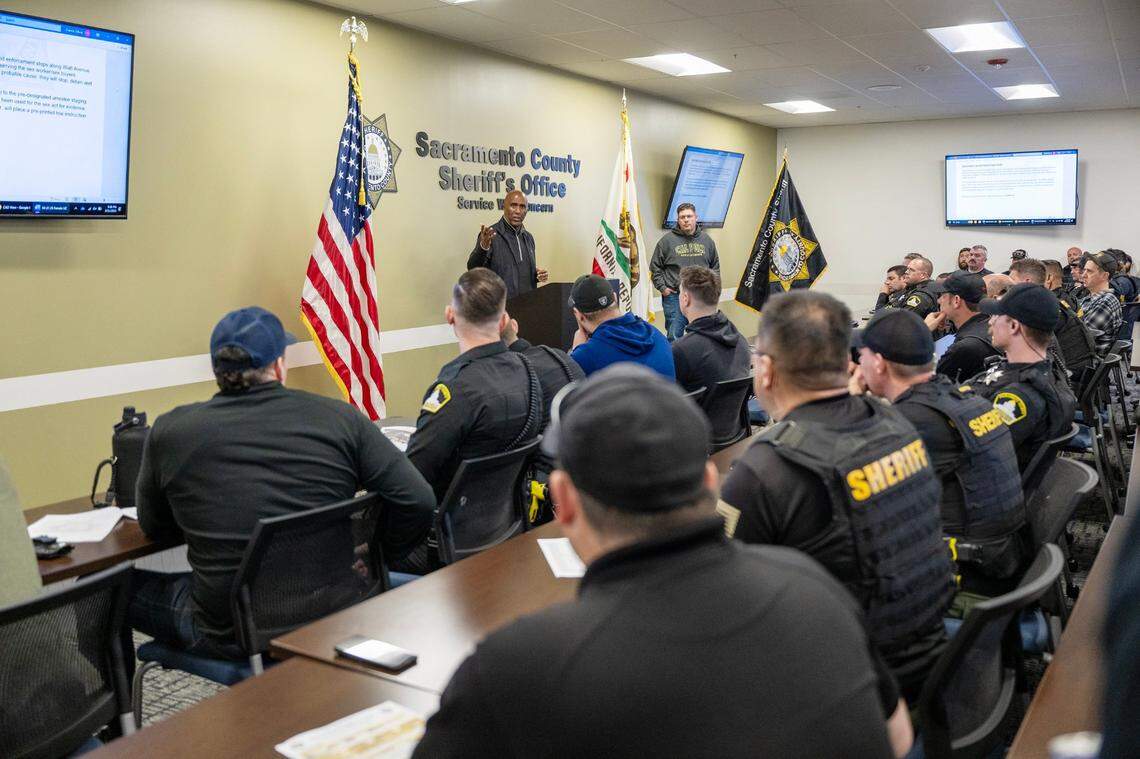 Sacramento Sheriff Jim Cooper speaks to deputies at a briefing before an operation to address prostitution on Watt Avenue in Sacramento County on Friday. The media was asked not to photograph undercover female deputies.
