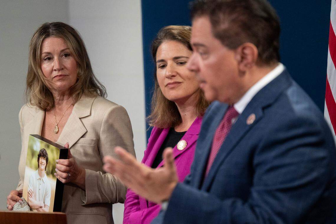 Maria Raine holds a photograph of her son Adam – a California teen who died after forming a parasocial relationship with an AU chatbot – during a news conference with state Sen. Steve Padilla, D-San Diego, and Assemblymember Rebecca Bauer-Kahan, D-Orinda, at the state Capitol swing space on Monday. The lawmakers discussed their bills, which would establish safeguards to help protect young users from harm related to chatbots.