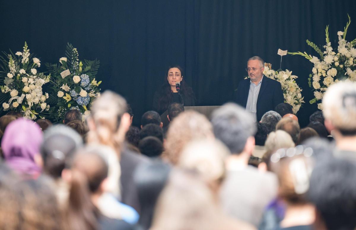 Nadine Yehya speaks while alongside Majdi Abou Najm during the “Celebration of Life” for their son, Karim Abou Najm, on Friday, May 5, 2023, at the UC Davis International Center on campus. Karim, a UC Davis senior, was fatally stabbed in Sycamore Park in Central Davis on April 29.