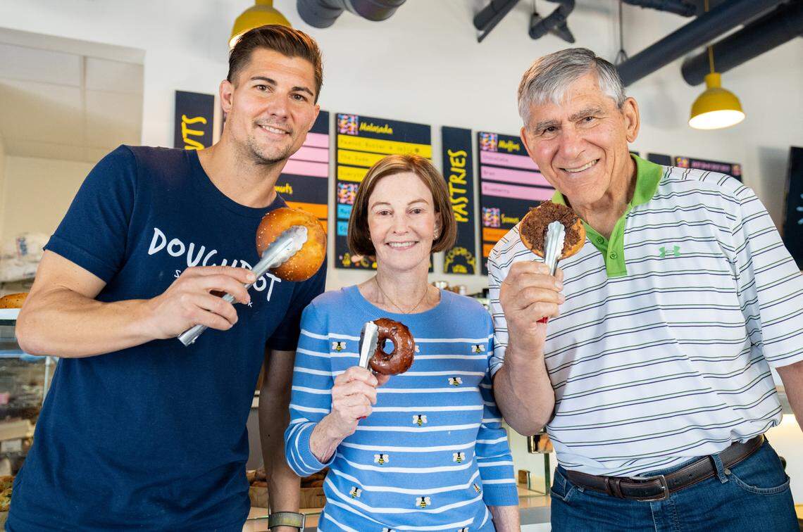 Doughbot owners Kevin Khasigian, left, Lynda Khasigian, center, and Fred Khasigian show some of the options on the menu on Thursday, July 28, 2022.