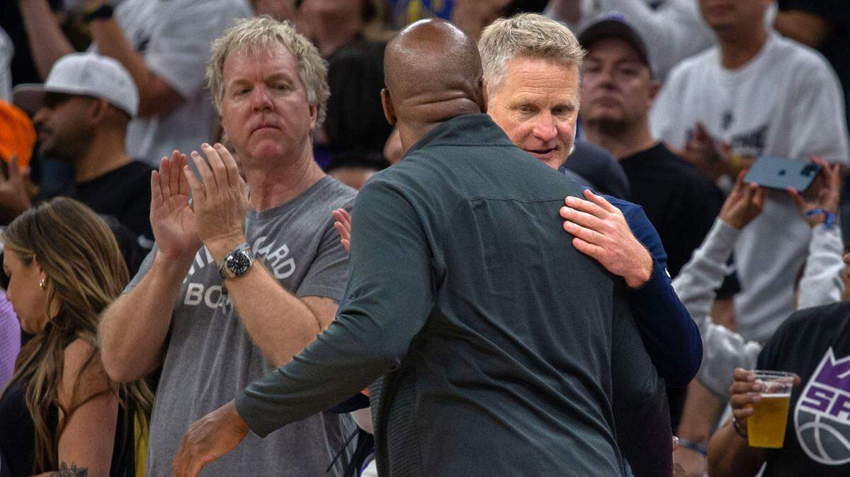 Sacramento Kings head coach Mike Brown and Golden State Warriors head coach Steve Kerr hug after Game 7 of the first-round NBA playoff series at Golden 1 Center on Sunday, April 30, 2023.