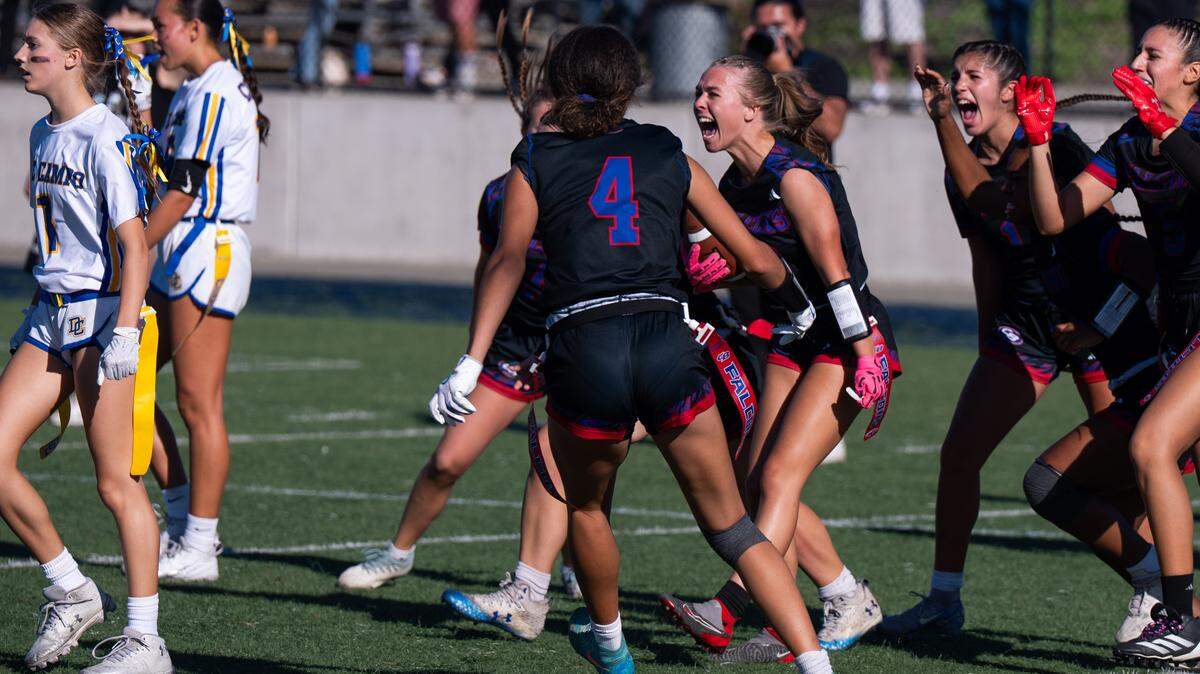 The Christian Brothers Falcons' Emma Leonard (13) celebrates after escaping several tackles to score the game-winning touchdown reception against the Del Campo Cougars in the CIF Sac-Joaquin Section Division III flag football championship on Saturday.