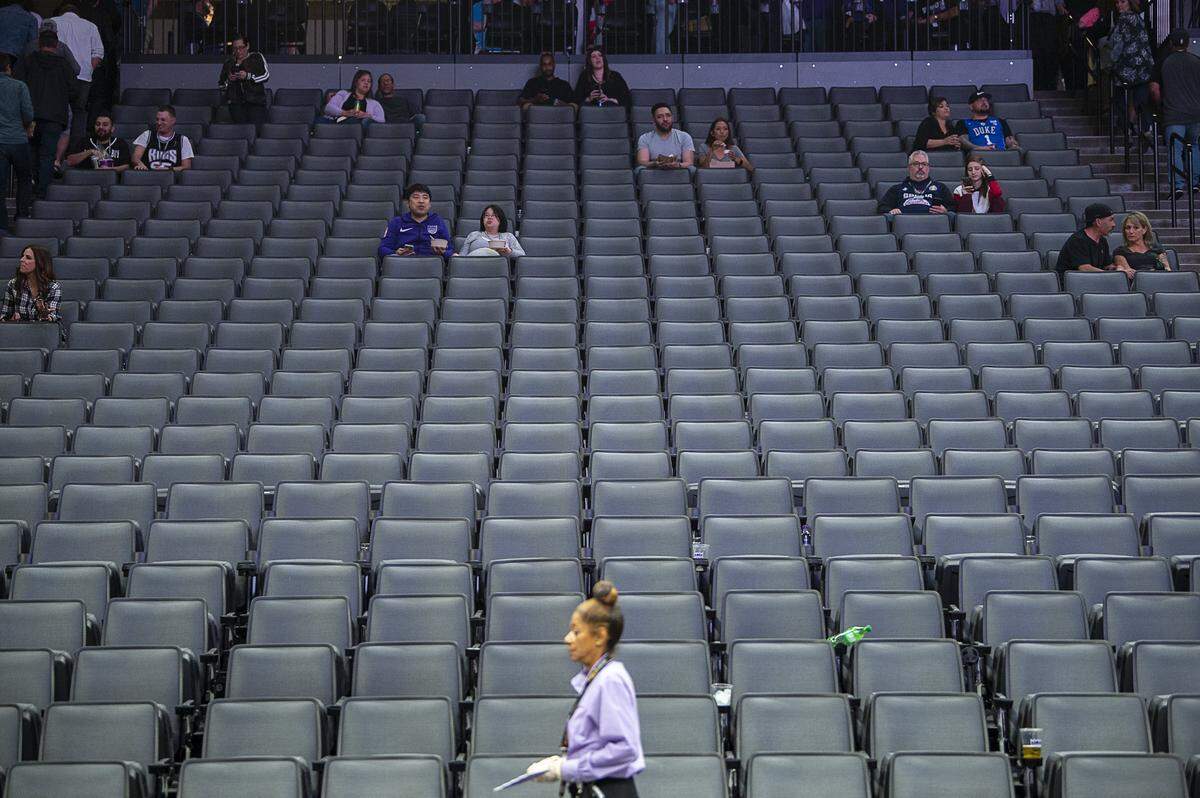 Sacramento Kings fans sit in the stands at Golden 1 Center on Wednesday, March 11, 2020, after the NBA postponed the Kings-Pelicans game and suspended the season. Earlier in the day, Utah Jazz’s Rudy Gobert tested positive for coronavirus.