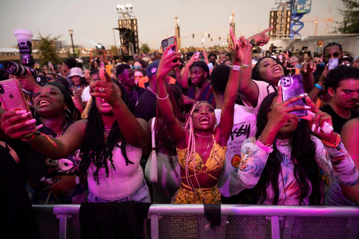 Fans get excited as Tekno sings on stage above them during the Lost in Riddim music festival on Saturday, Oct. 1, 2021, at the Sacramento Railyards district.