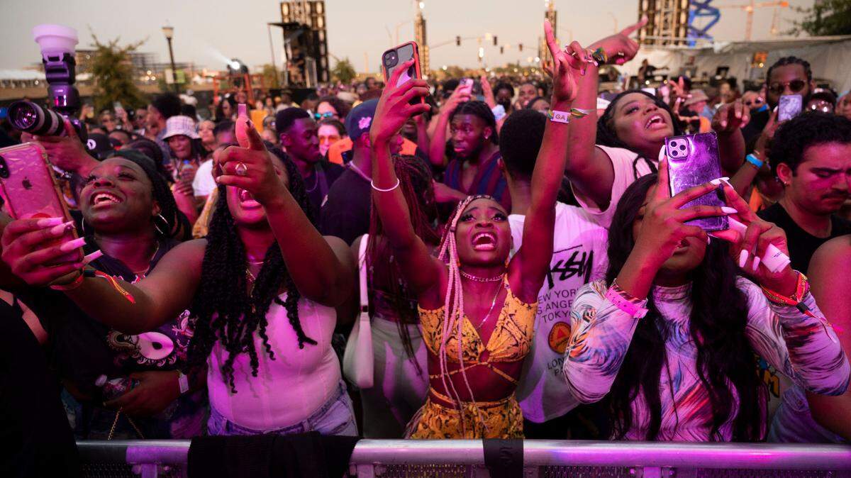 Fans get excited as Tekno sings on stage above them during the Lost in Riddim music festival on Saturday, Oct. 1, 2021, at the Sacramento Railyards district. As shows and festivals come back, make sure you’re buying your tickets safely.