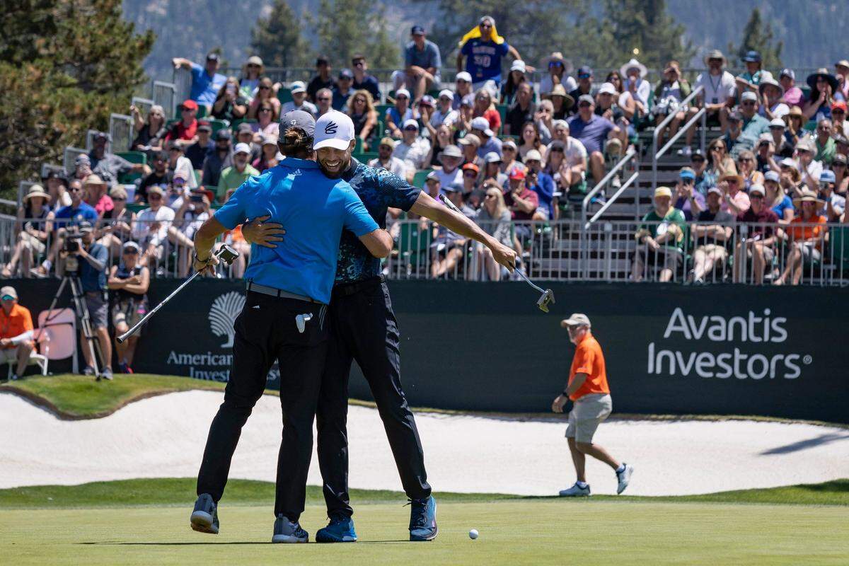 Green Bay quarterback and Northern California native Aaron Rodgers, left, hugs Golden State Warriors star Stephen Curry after finishing the eighteenth hole during the American Century Celebrity Golf Championship Tournament at Edgewood Tahoe Golf Course in Stateline, Nev., on Sunday, July 10, 2022. The 2022 NBA Finals MVP finished the day tied for 16th place with Hall of Fame pitcher John Smoltz, while Rodgers finished 9th.