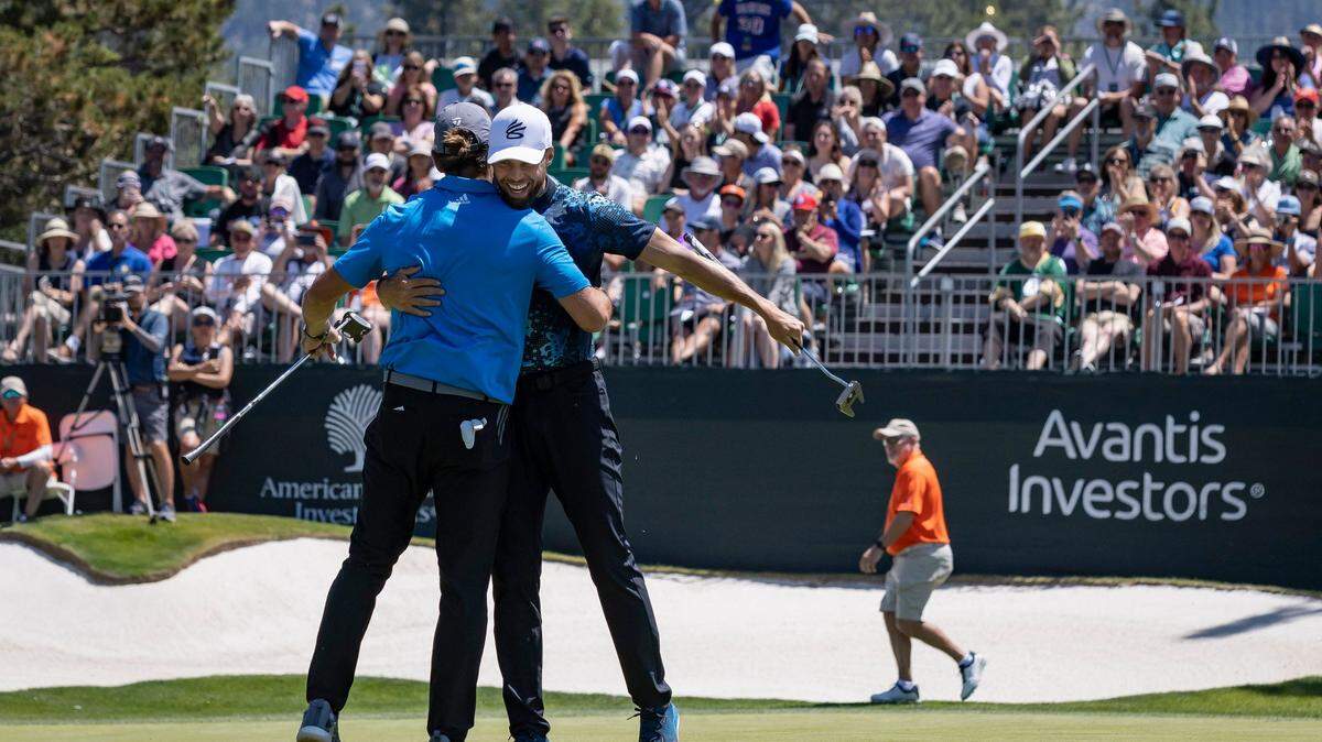 Green Bay quarterback and Northern California native Aaron Rodgers, left, hugs Golden State Warriors star Stephen Curry after finishing the eighteenth hole during the American Century Celebrity Golf Championship Tournament at Edgewood Tahoe Golf Course in 2022.