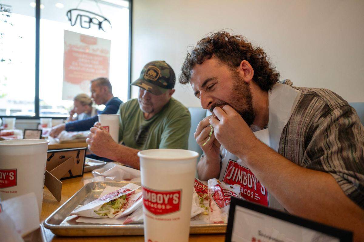 Sacramento Bee’s food writer Benjy Egel crams down six out of seven tacos during the Jimboy’s Tacos Eating Contest on Wednesday at one of their Folsom locations. He tied for second place against other local media personalities.
