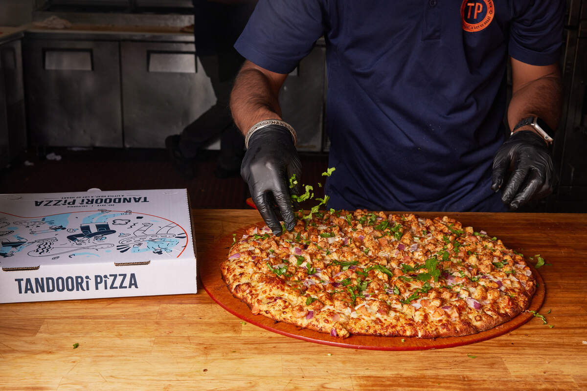 Tandoori Pizza, a chain pizzeria based in the Bay Area, creates Indian fusion pizza pies generously topped with flavors like malai paneer, veggie curry and chicken tikka, along with traditional Italian pizzas.