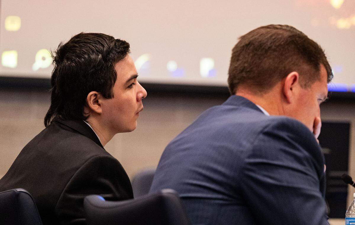 Stabbing suspect Carlos Reales Dominguez listens to Kimberlee Guillory, who was stabbed in her in tent while living on L Street in Davis, testify in his trial while deputy public defender Daniel Hutchinson, right, takes notes on Wednesday, May 7, 2025, in Yolo Superior Court in Woodland.